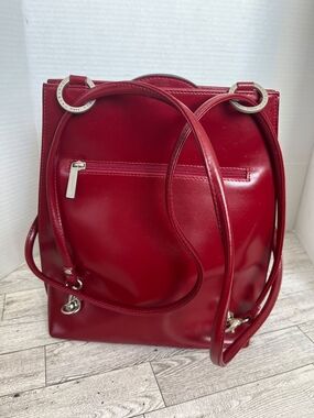 Sleek Red Patent Backpack with Silver Accents